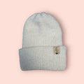 off-white merino wool hat, very soft and fluffy