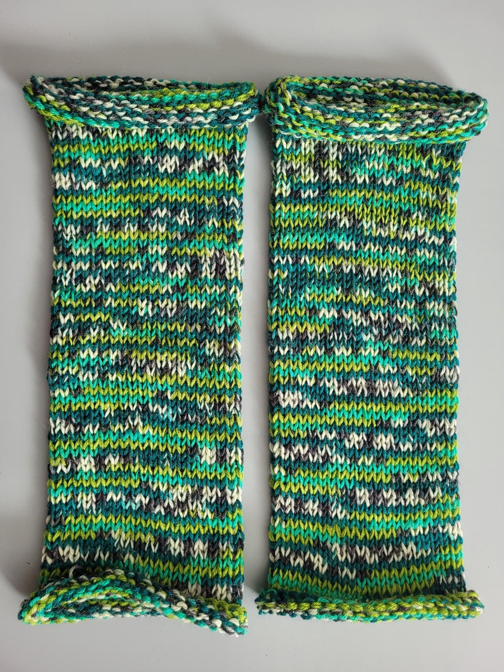 handmade leg warmers,  woolen and breathable,  shades of green,  dark grey and cream