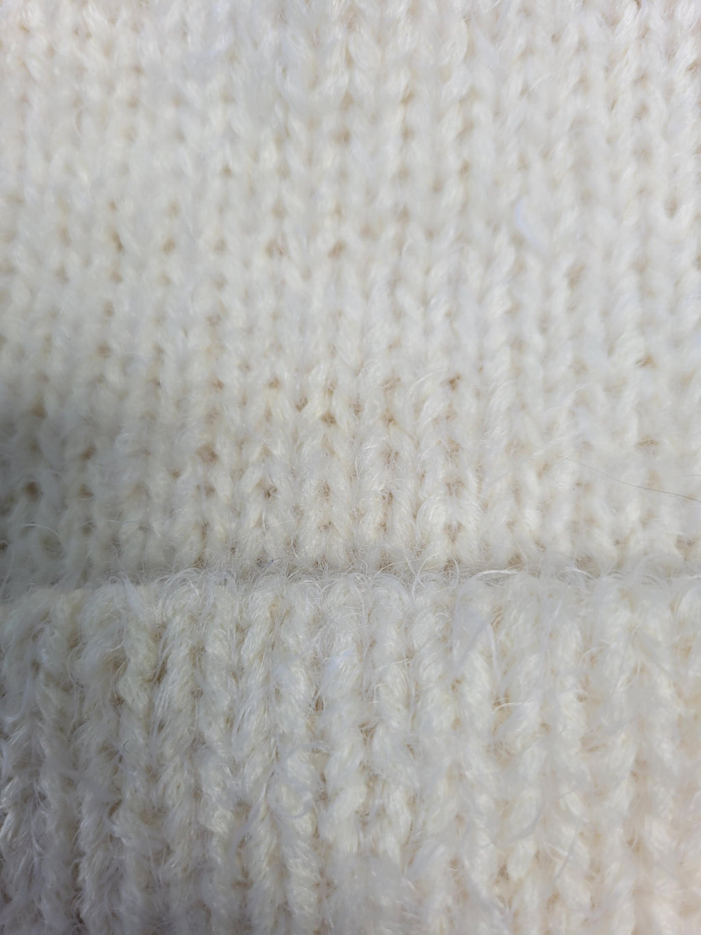 off-white merino wool hat, very soft and fluffy